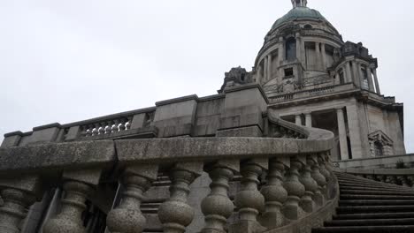 Looking-up-at-wealthy-historic-Ashton-memorial-landmark-historical-estate-building-ornate-stairs-slow-left-dolly