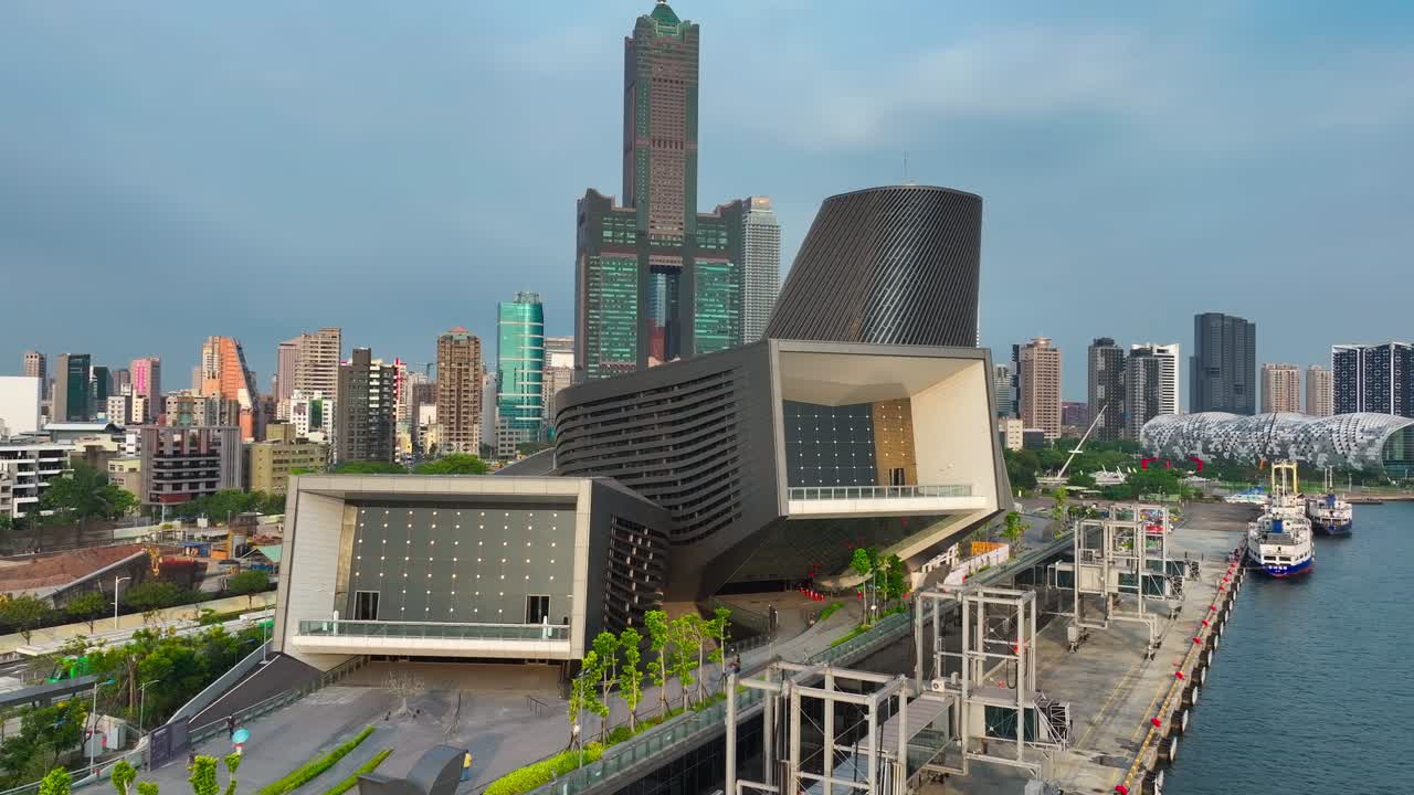 Aerial establishing shot of Kaohsiung Cruise Terminal and Tuntex Tower in background,