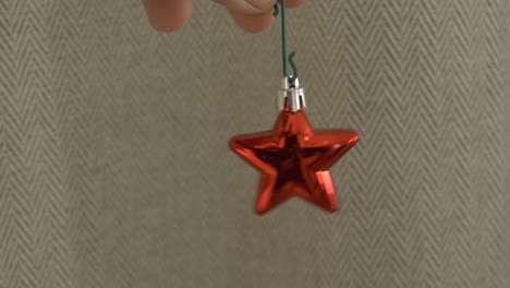 hanging red christmas bauble shaped as a star