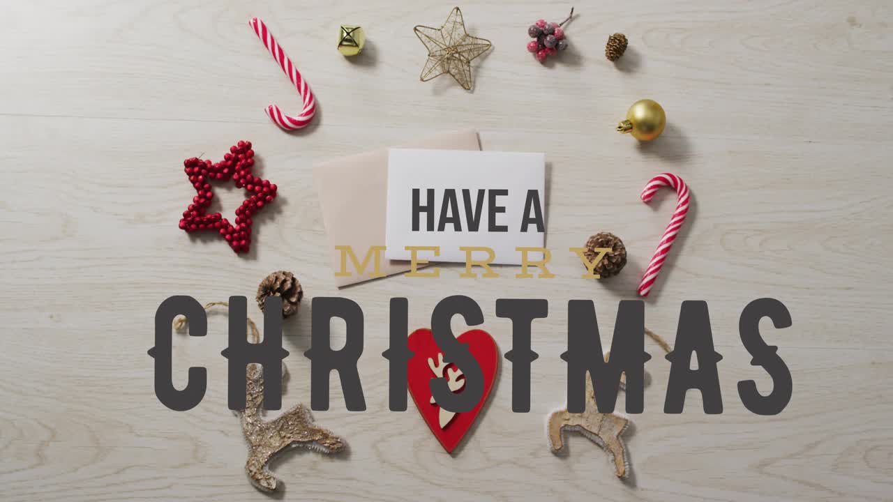 Playhead moving, large gray letters sliding across flat-lay, spelling CHRISTMAS, revealing greeting