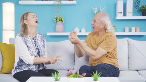 Married-couple-playing-fun-games-at-home.