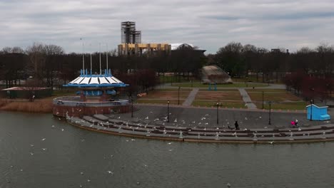 an aerial view of meadow lake in flushing meadows corona park in ny on a cloudy day