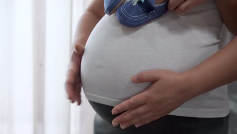 pregnant couple feels love and relax at home.