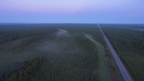 drone shot of blues skies over the highway with no cars