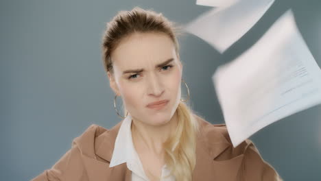 Angry-business-woman-throwing-papers-in-slow-motion