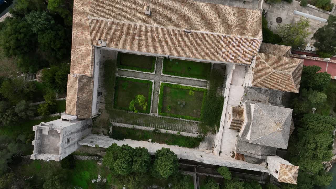 Ancient monastery courtyard in Mljet, aerial view of a symmetrical green garden