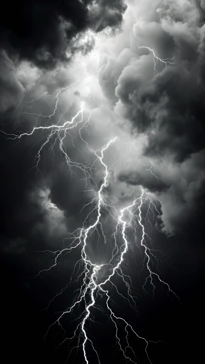 Dramatic upward angle captures intense lightning bolts piercing dark storm clouds, ideal for a video