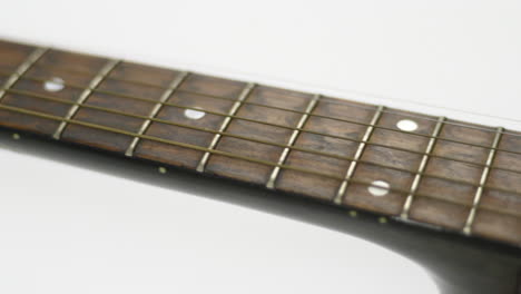 sideways sliding view of an acoustic guitar