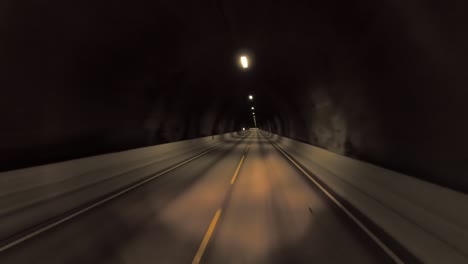 car rides through the tunnel point-of-view driving in norway. light at the end of the tunnel.