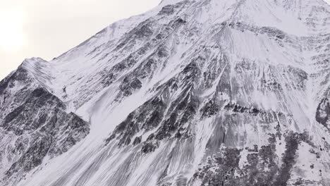 snowy mountains during winter in kluane national park in yukon, canada - drone shot