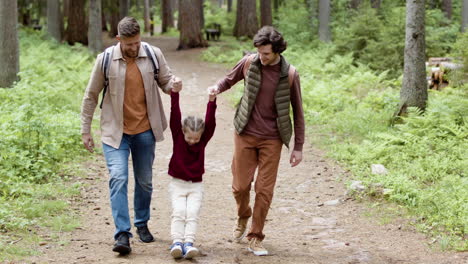 Family-enjoying-the-walk-in-the-forest