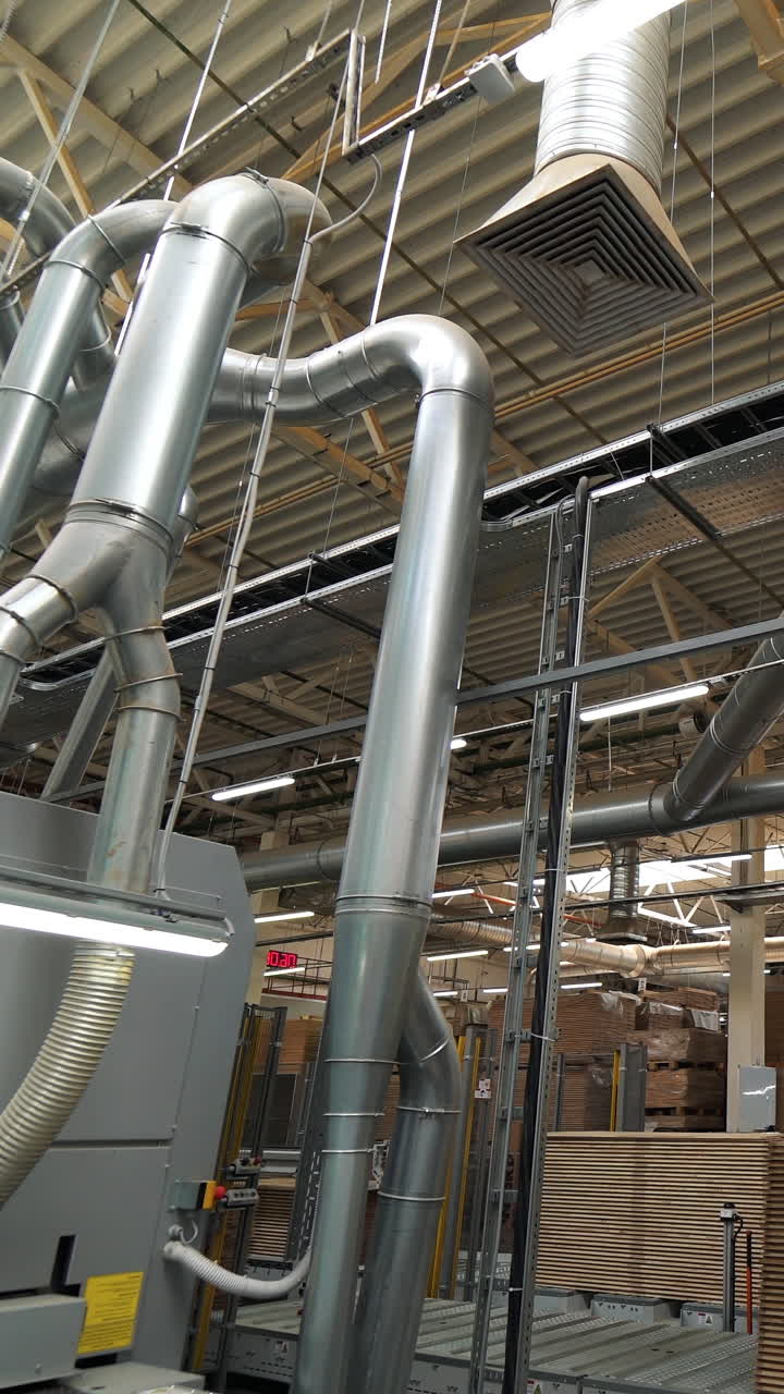 ventilation system inside the plant of the production of parquet boards. Modern technology of industry. Vertical video
