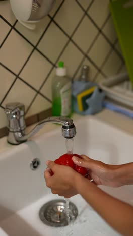 washing vegetables in the kitchen