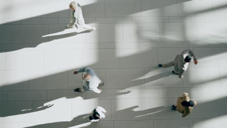 Business-people,-walking-and-top-view-in-office