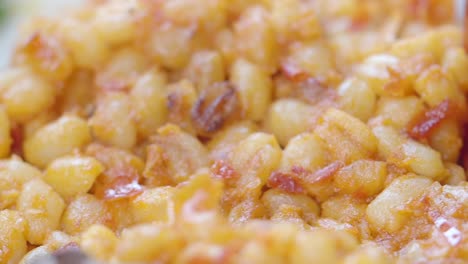 close-up of roasted beans with bacon