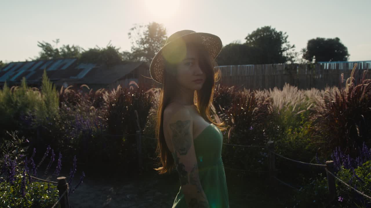 Woman in a garden at sunset