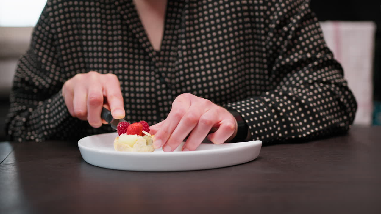 Woman Shares Fruit Pastry Food Sitting At Table In The Morning
