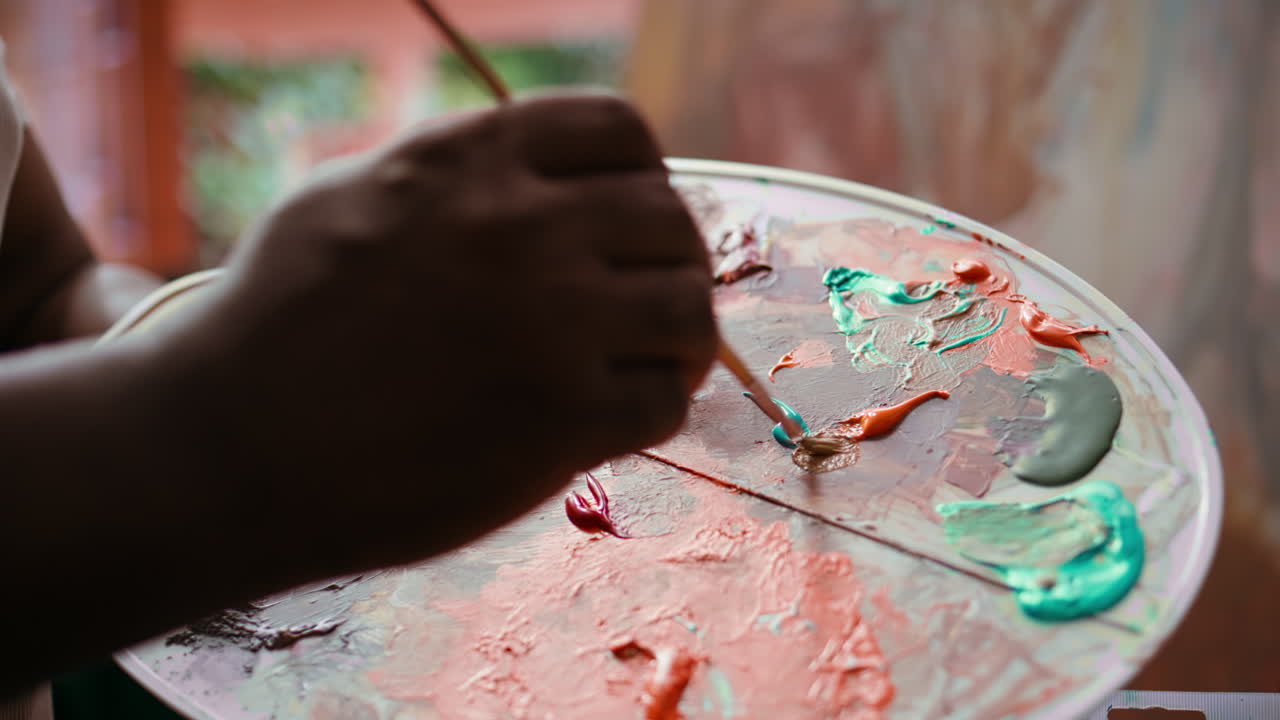 Close-up of Artist's Palette with Brush and Paint