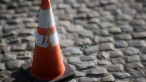 orange and white striped traffic cone