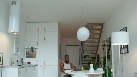 man working from home in a modern kitchen