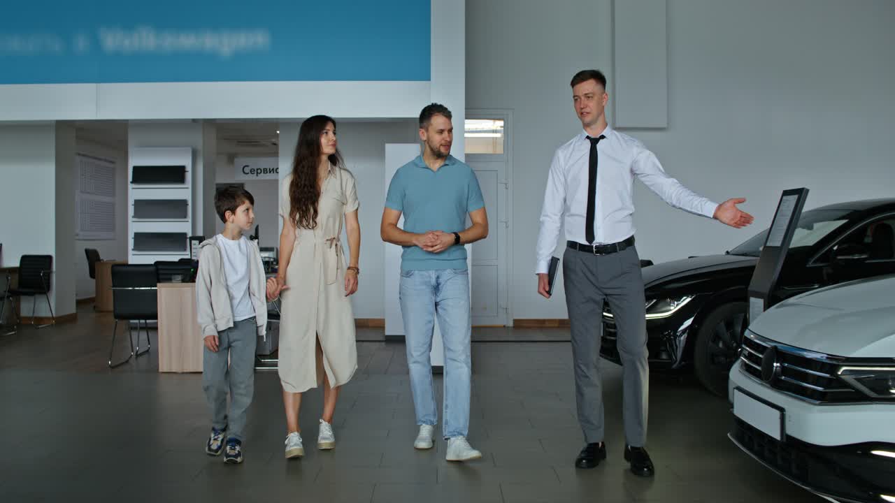 Family visiting a car dealership