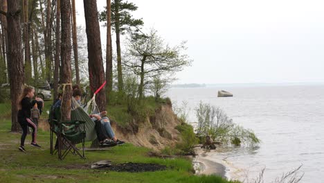 family camping by the river