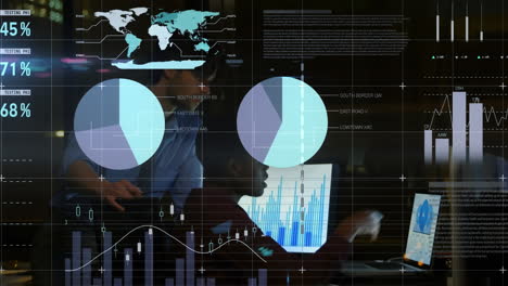 animation of statistics and data processing over businessmen using laptop