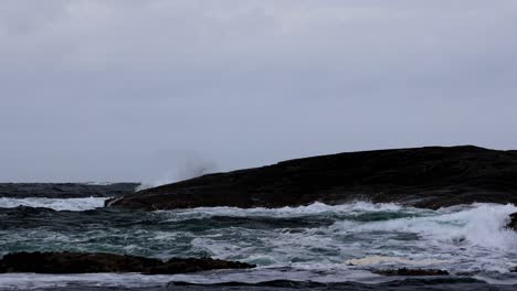 rough sea pounds shore in western norway