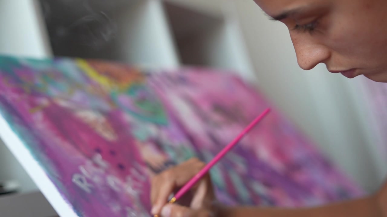 Young Artist Painting on Canvas in Her Studio