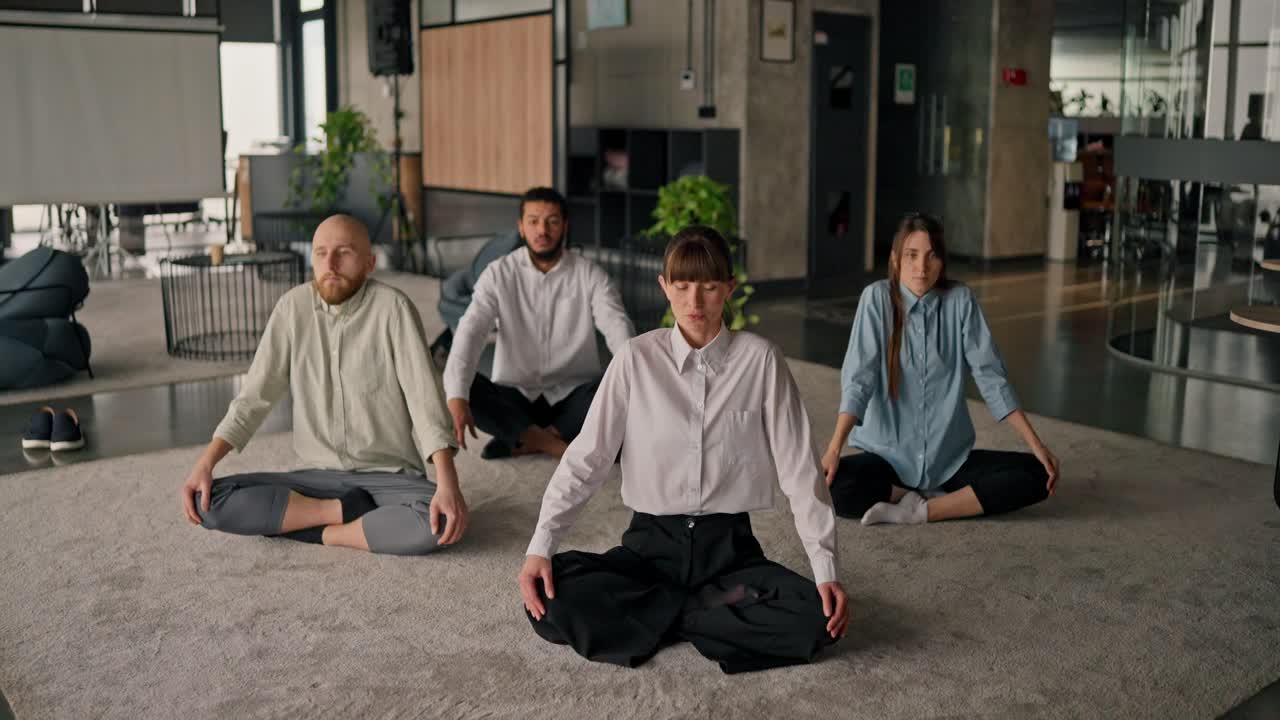 Employees Meditating in Office