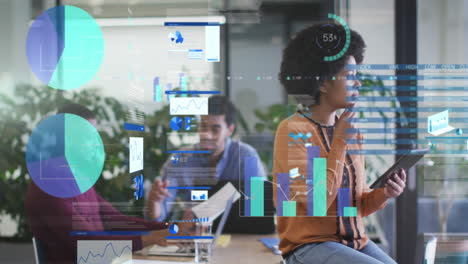 african american woman processes data on tablet in office for business tech.