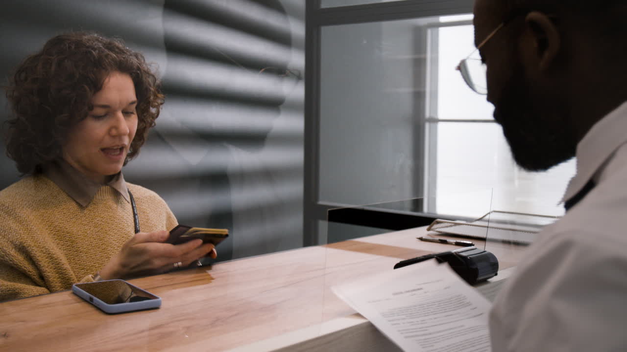 Transaction at a Counter with Protective Barrier