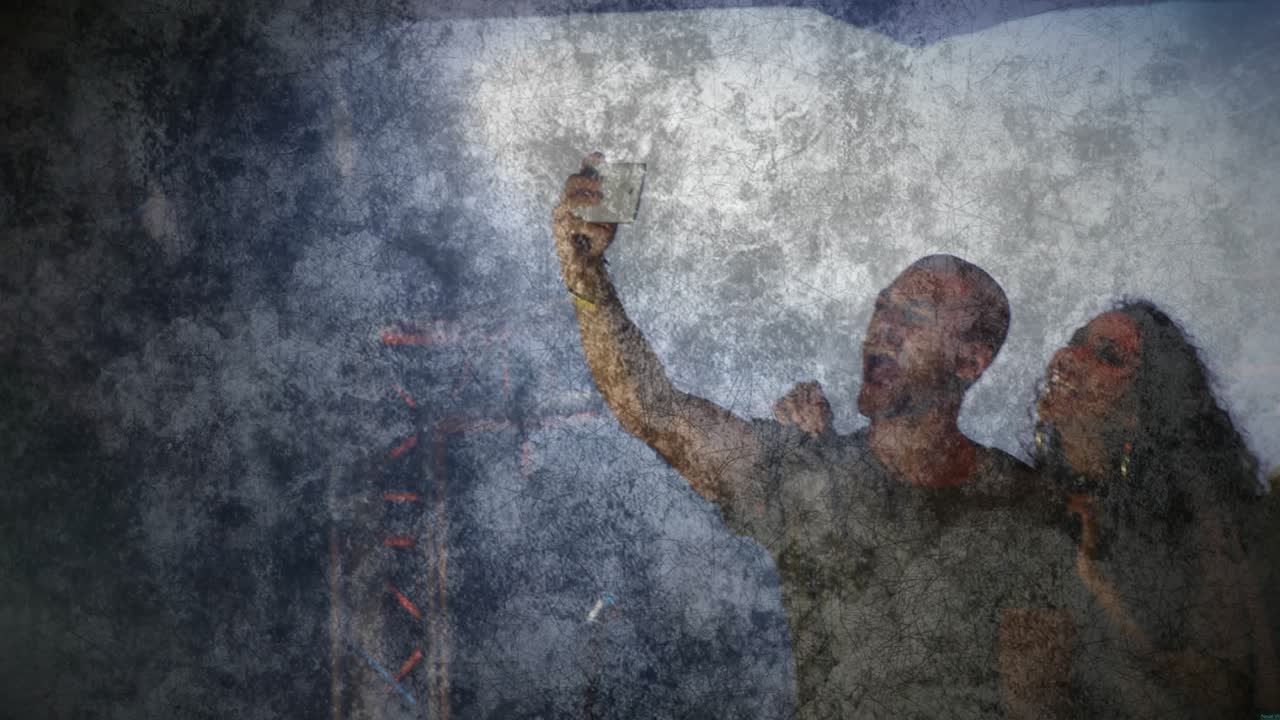 Lead man lifting phone, urging group posing and checking selfie at music set, grunge overlay