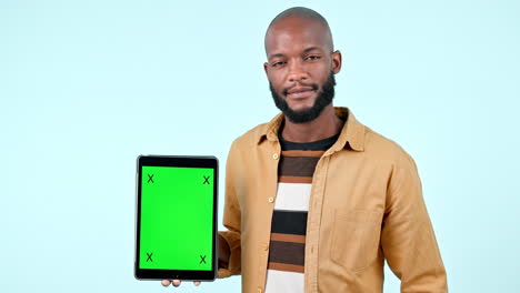 Man,-tablet-mock-up-and-green-screen-in-studio