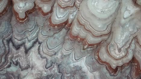 birds eye aerial view of scenic striped sandstone hills and rock formations in utah desert, hanksville usa