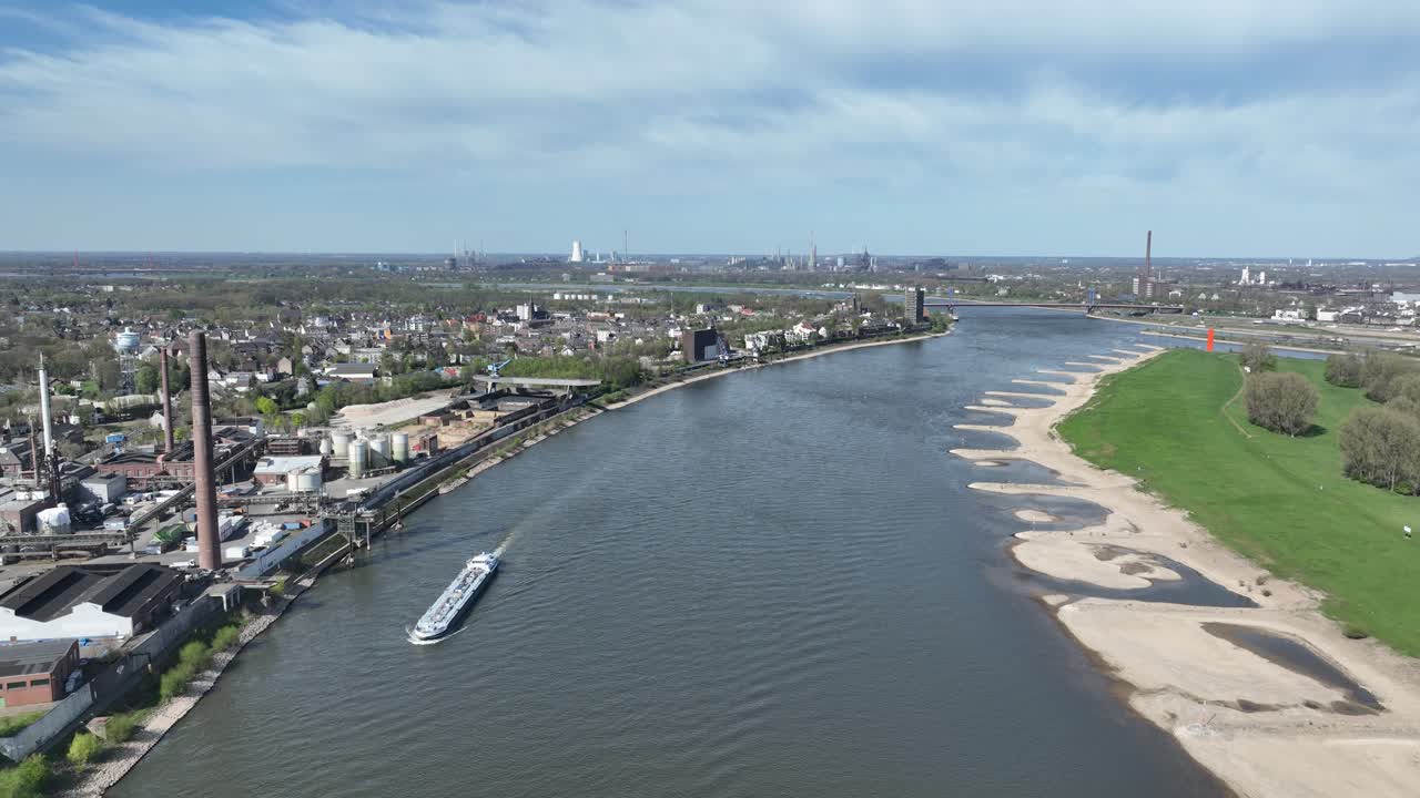Rhine river, industrial ruhr region, shipping waterway for industrial transport. Infrastructure, Trade and industry in Germany. Aerial view.