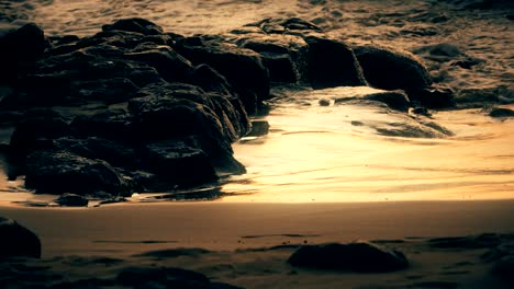 waves rolling onto a beach in maui