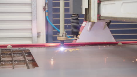 sparks off plasma cutter cutting metal sheet in 4k slow motion