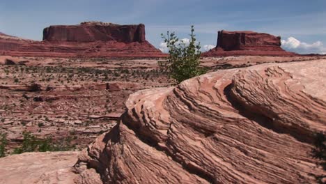 longshot of two sandstone formations at monument valley tribal park in arizona and utah