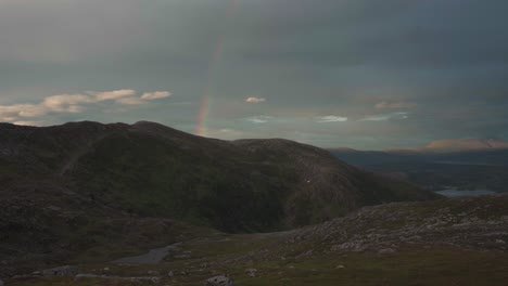 rainbow over grytetippen peak in senja, fjordgard, norway