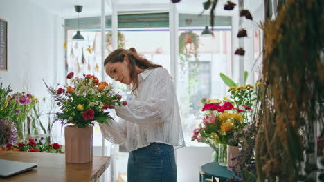 busy florist make bouquet in flower shop workplace. small business owner work.