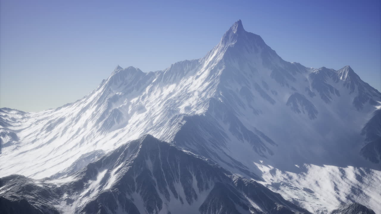 Majestic mountain landscapes under a clear blue sky at dawn in winter