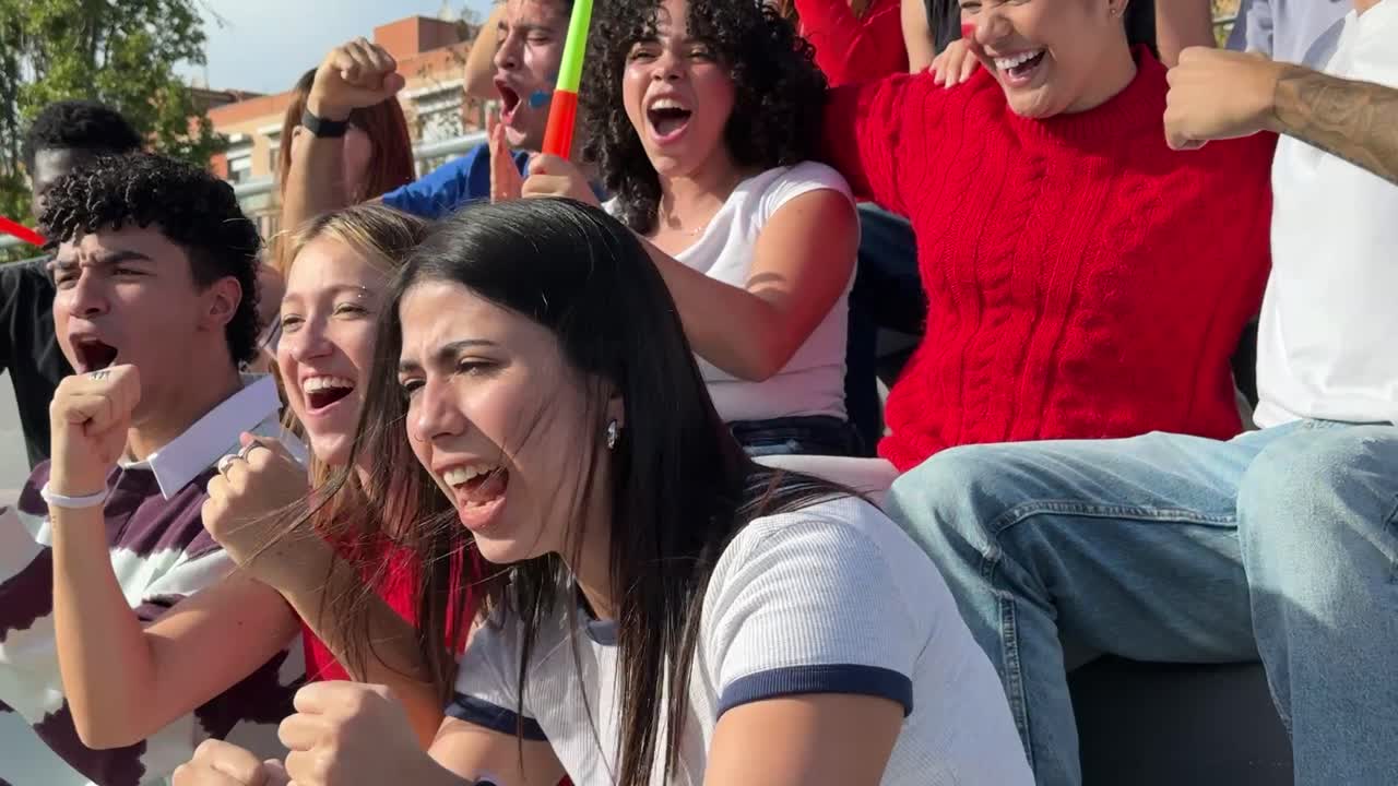 Excited fans cheering for their team