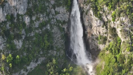 Wide-aerial-perspective-of-Seerenbachfälle-waterfalls,-highlighting-their-majestic-descent