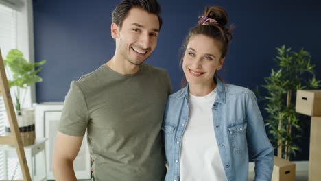 handheld video portrait of young couple in new house.