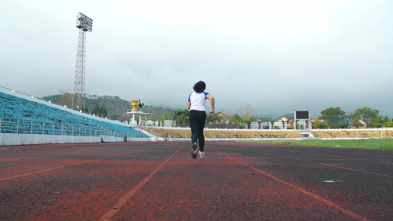 Little Girl Running At Stadium