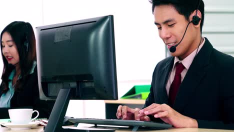 business people wearing headset working in office