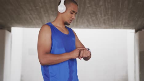 side view man with prosthetic leg looking at his watch