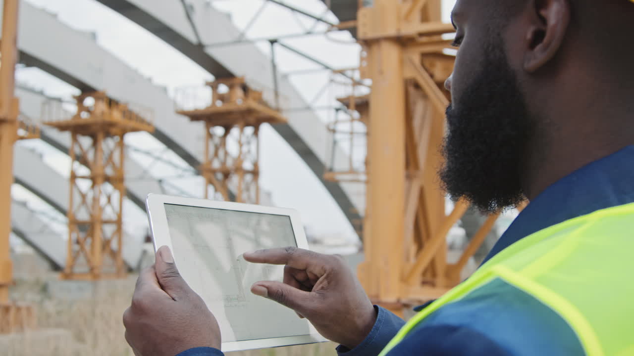Black Male Engineer Working at Construction Site