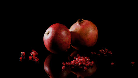 pomegranate on black background 4k